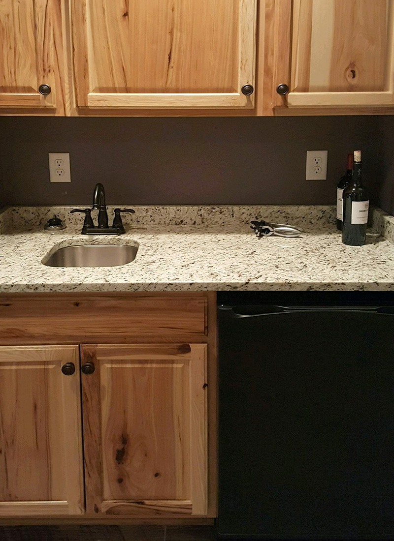 Knotty pine cabinets with natural color countertop