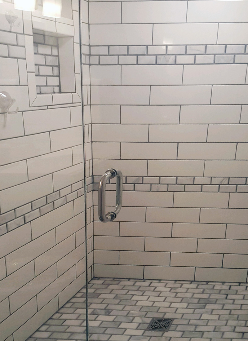 Shower white subway tile remodel front view